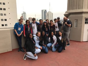 harvey students pose for a group shot on a rooftop in buenos aires