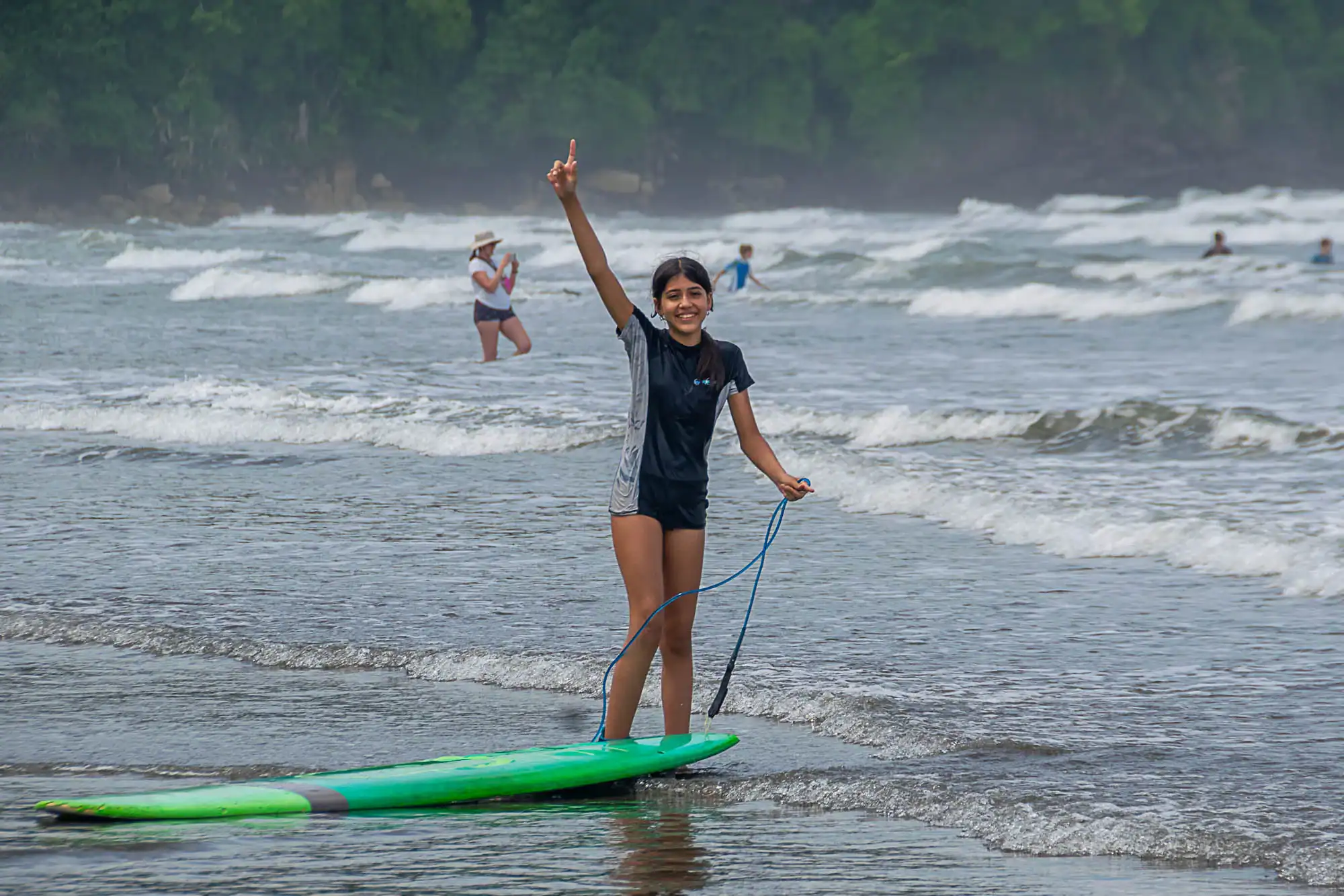 A middle school student traveler enjoying a day of adventure surfing. Global Works Teen travel programs offer a mix of learning, adventure and service.