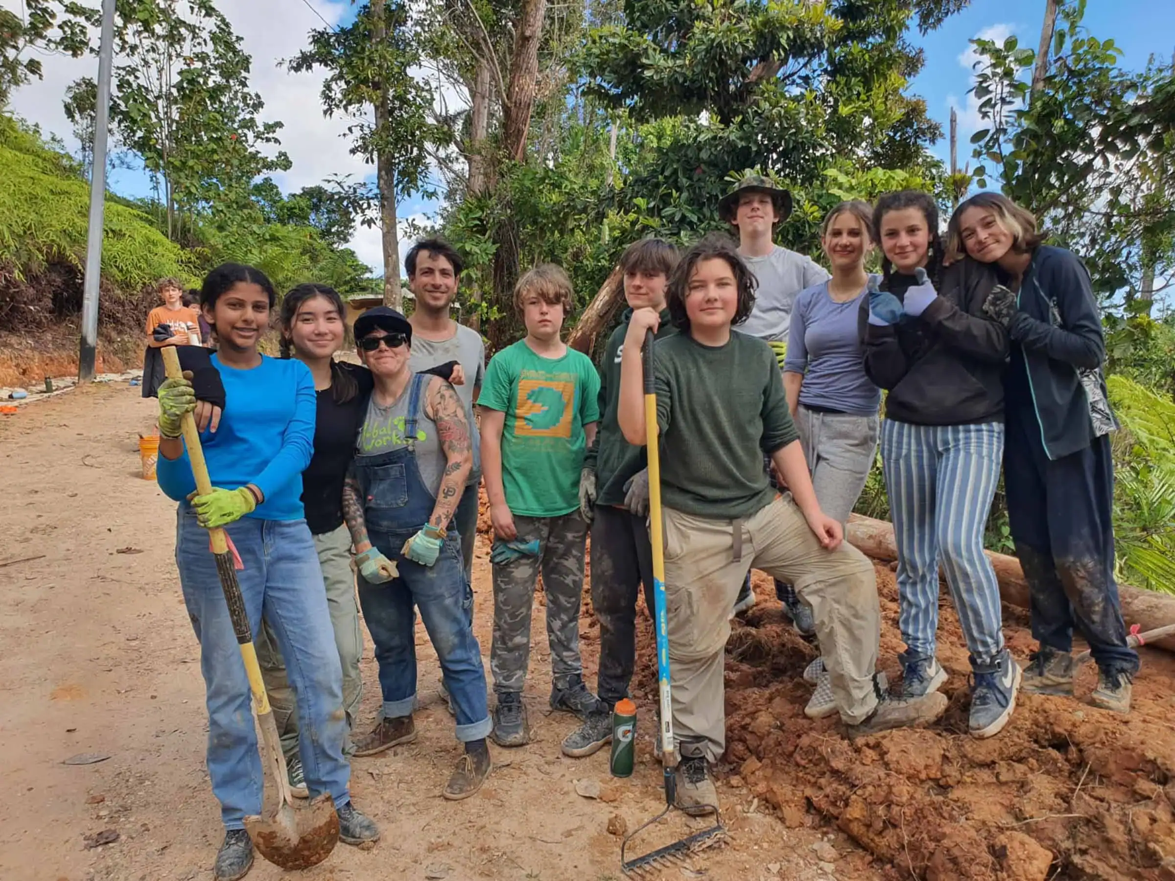 A group of teenagers from Global Works' many teen travel programs working on a community service or environmental project abroad.