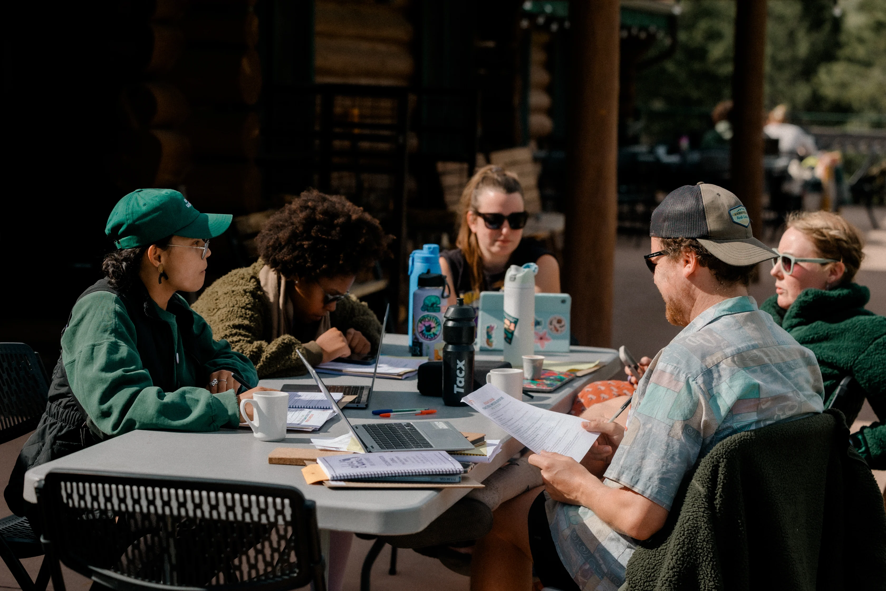 Global Works staff reviewing safety plans and program details during annual staff training.